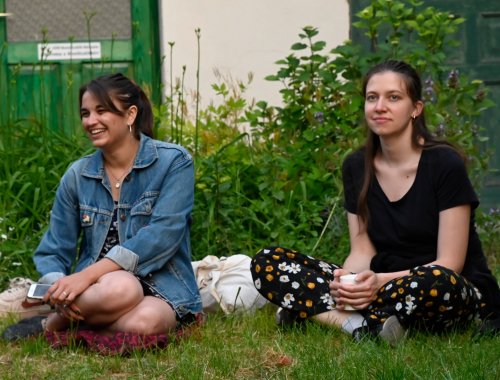 Young women sitting in the grass.