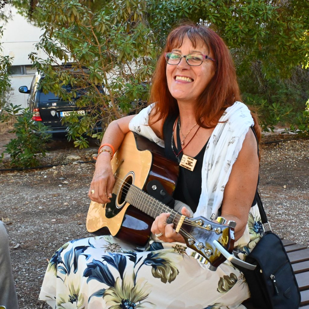 Woman playing guitar.